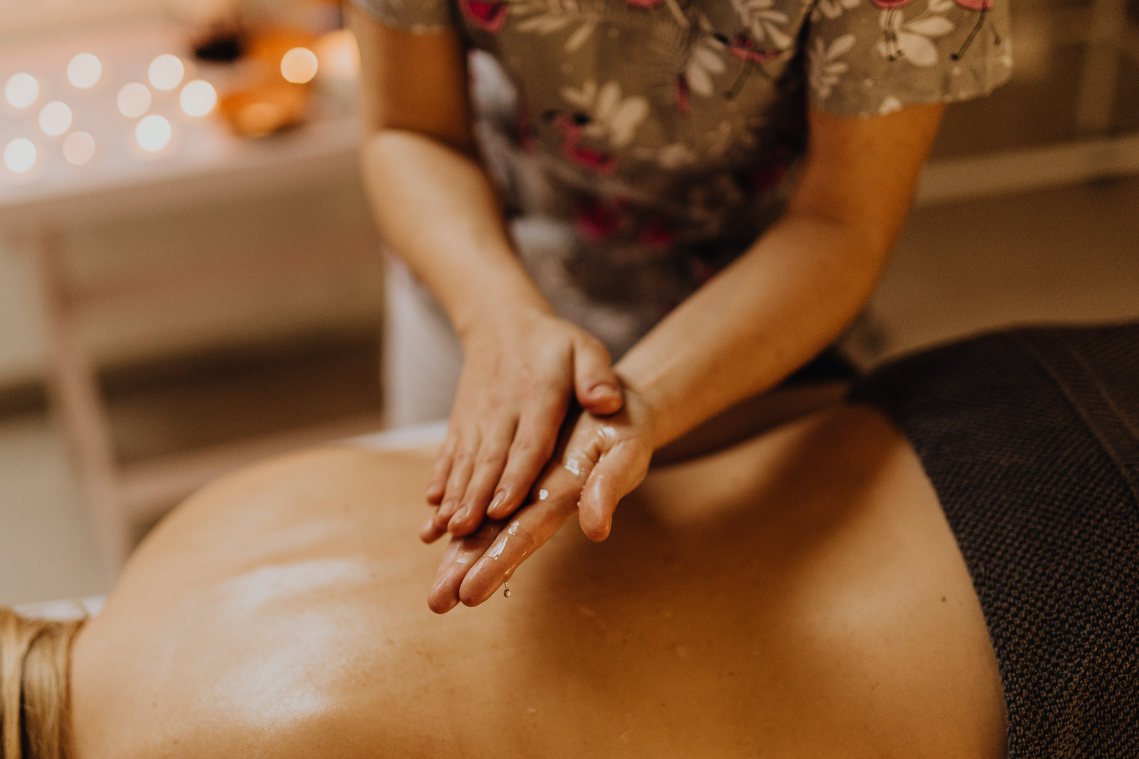 A Masseuse with Massage Oil on Her Hands